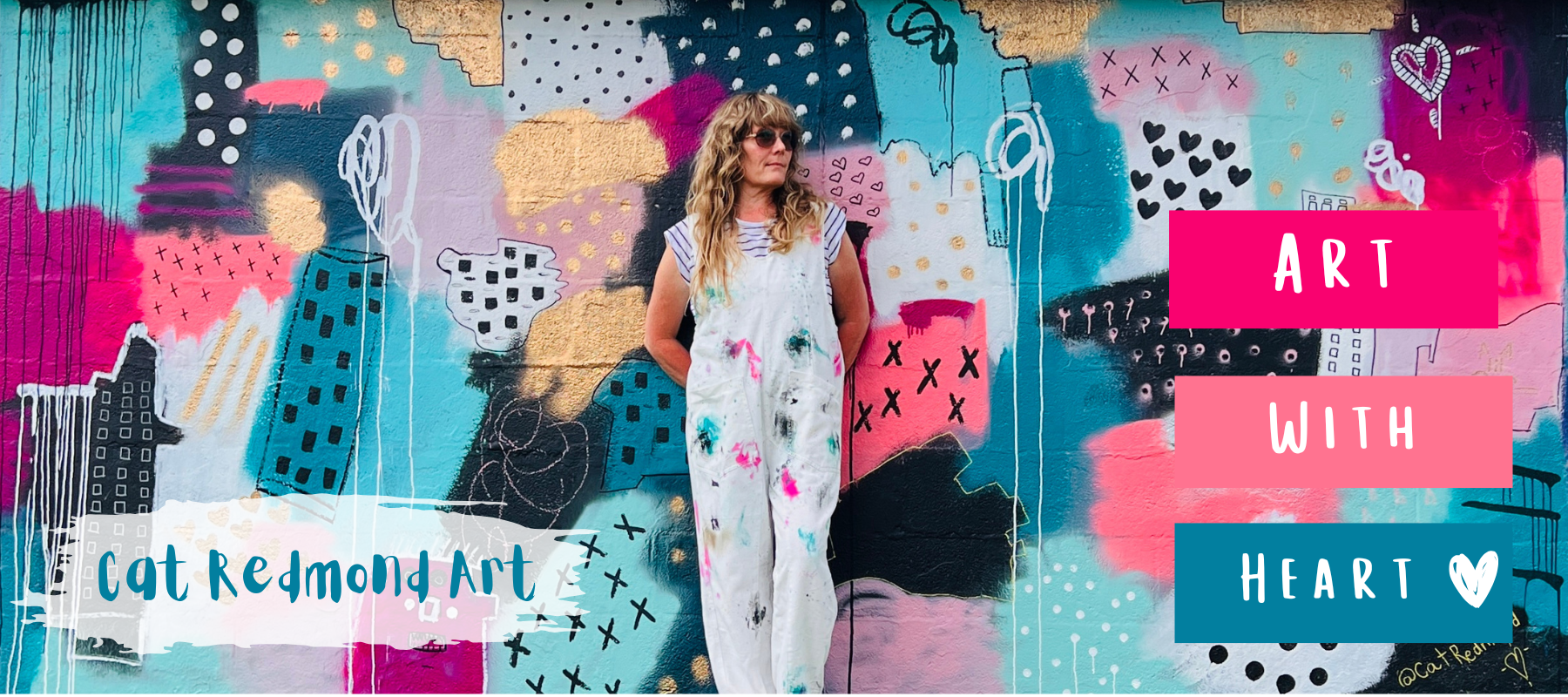 Woman standing in front of a colorful abstract mural with 'Cat Redmond Art' and 'Art with Heart' text.