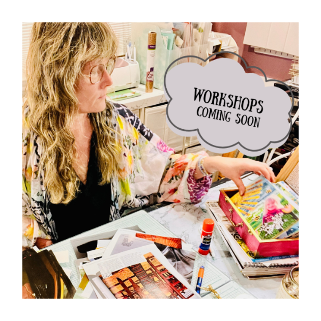 A woman with long blonde hair and glasses sits at a desk surrounded by craft supplies, papers, and boxes, with a speech bubble overlay that reads 'WORKSHOPS COMING SOON'.